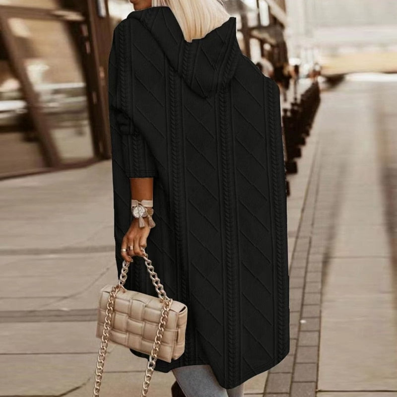 Women's long hooded winter coat with plush lining, windproof design, and contemporary silhouette