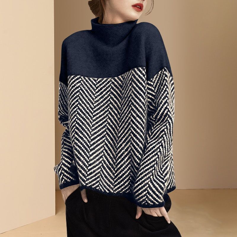 Women's loose fit turtleneck sweater with bold chevron pattern, cozy knitwear layering essential