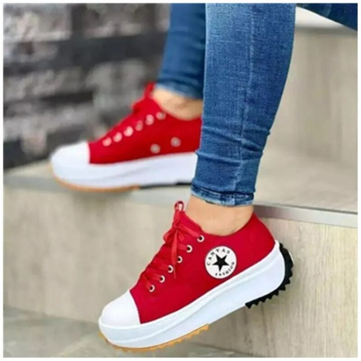 Women's white low-top canvas chunky sole sneakers with bold platform rubber outsole for everyday style
