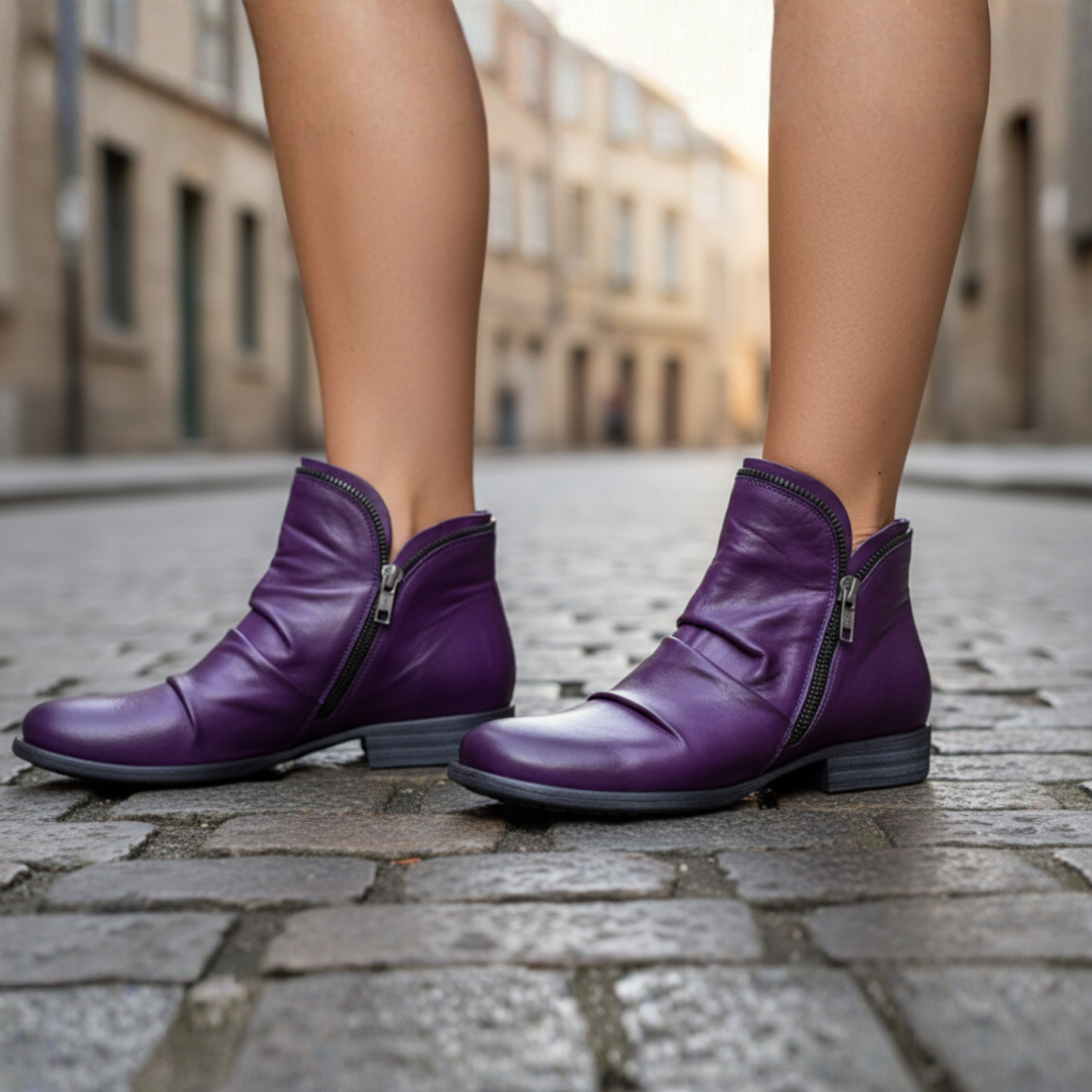 Women's black ankle boots with side zipper, sleek silhouette, casual everyday style for effortless wear