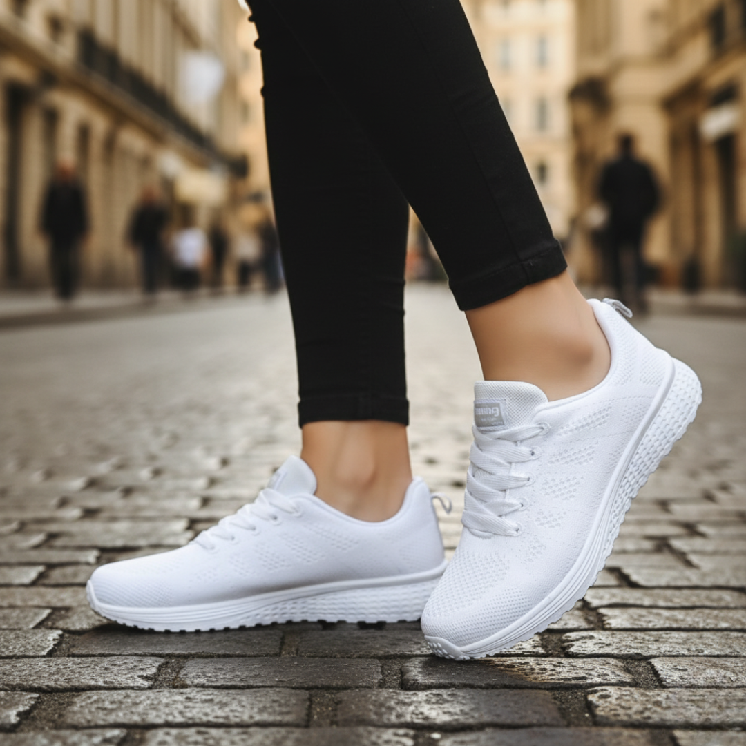 Women's breathable mesh running shoes in black with non-slip white sole for training and daily wear