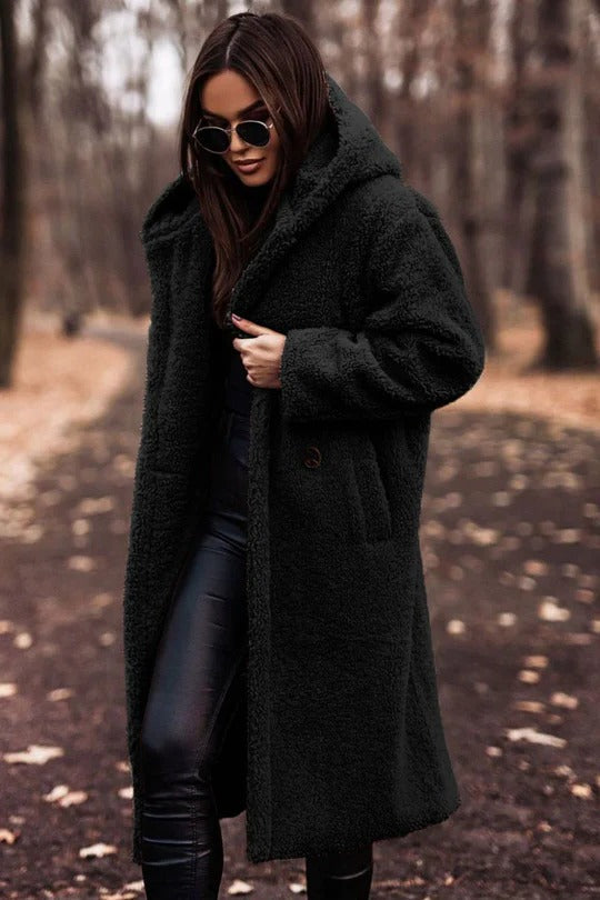 Women's insulated mid-length winter coat with high collar, belted waist, and button-front closure