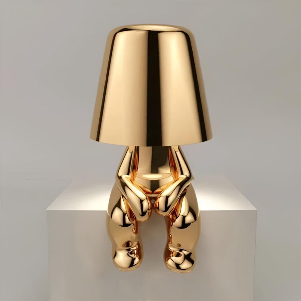 Gold Art Deco figurine table lamp with warm ambient glow, cordless rechargeable decorative accent