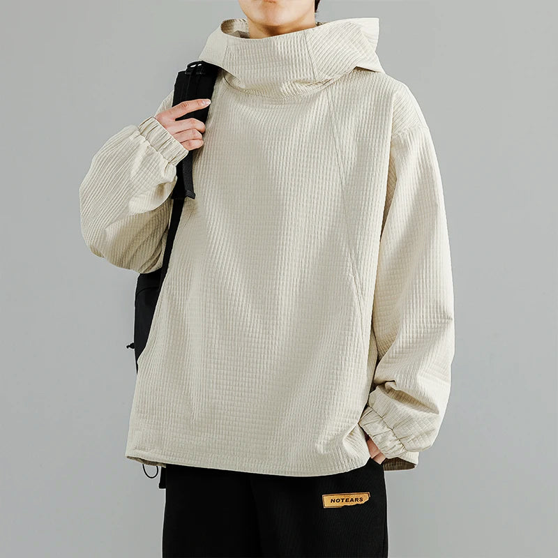Men's oversized baggy black hoodie with relaxed fit and textured knit streetwear silhouette