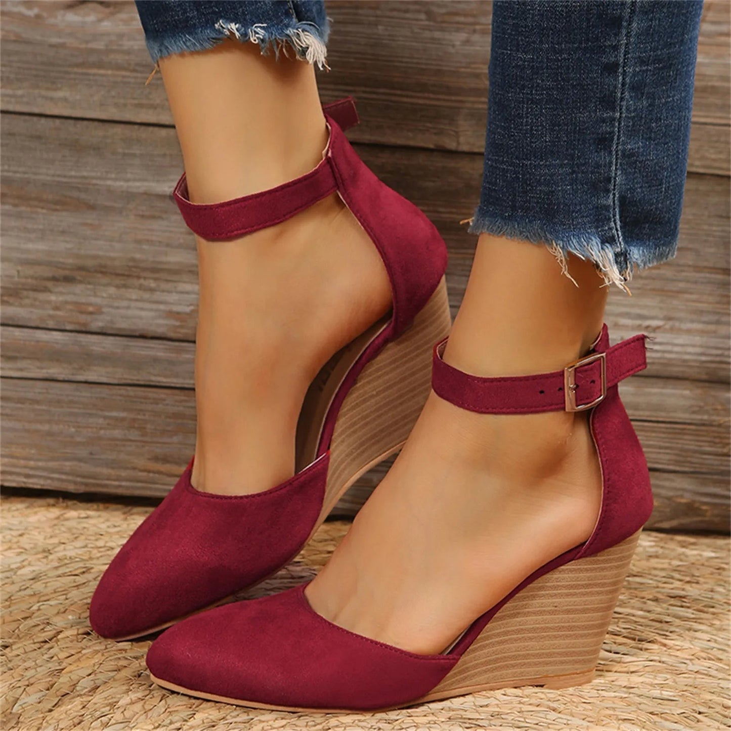 Women's suede wedge heel closed-toe shoe with ankle strap and sculpted wood-grain wedge sole