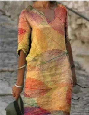 Women's floral midi dress, V-neck, artistic face print with delicate floral accents, sophisticated everyday style