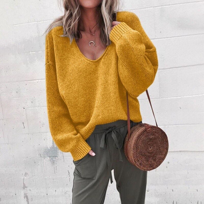 Modern women's professional cream knit sweater with classic silhouette and timeless elegant design