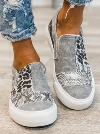 Women's white slip-on platform sneakers with clean minimalist design for all-day comfort