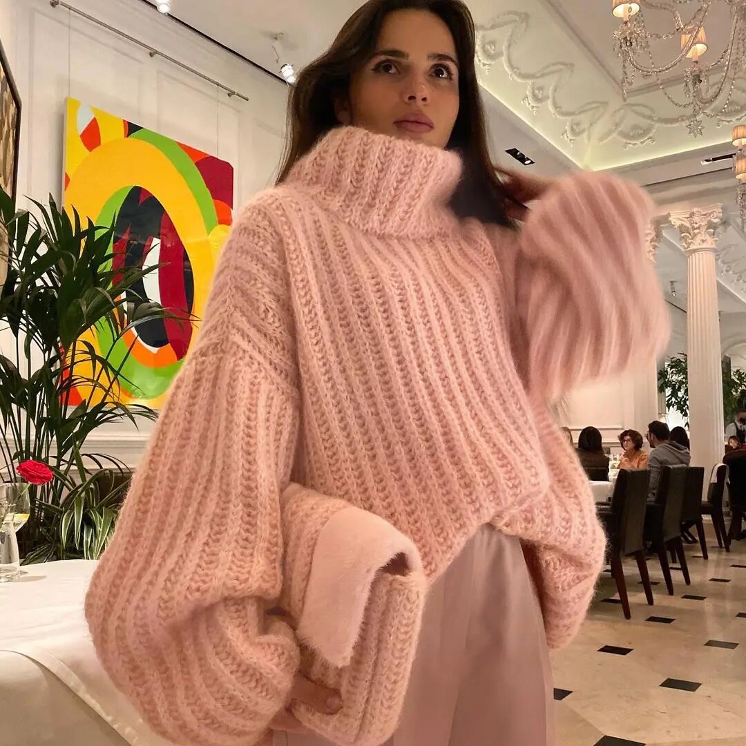 Women's oversized cream turtleneck sweater relaxed fit wide sleeves cozy layering essential