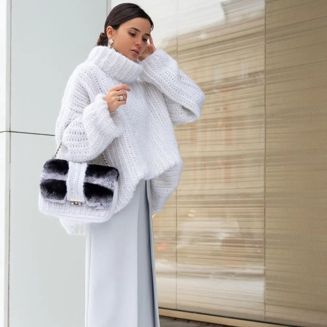 Women's oversized cream turtleneck sweater relaxed fit wide sleeves cozy layering essential