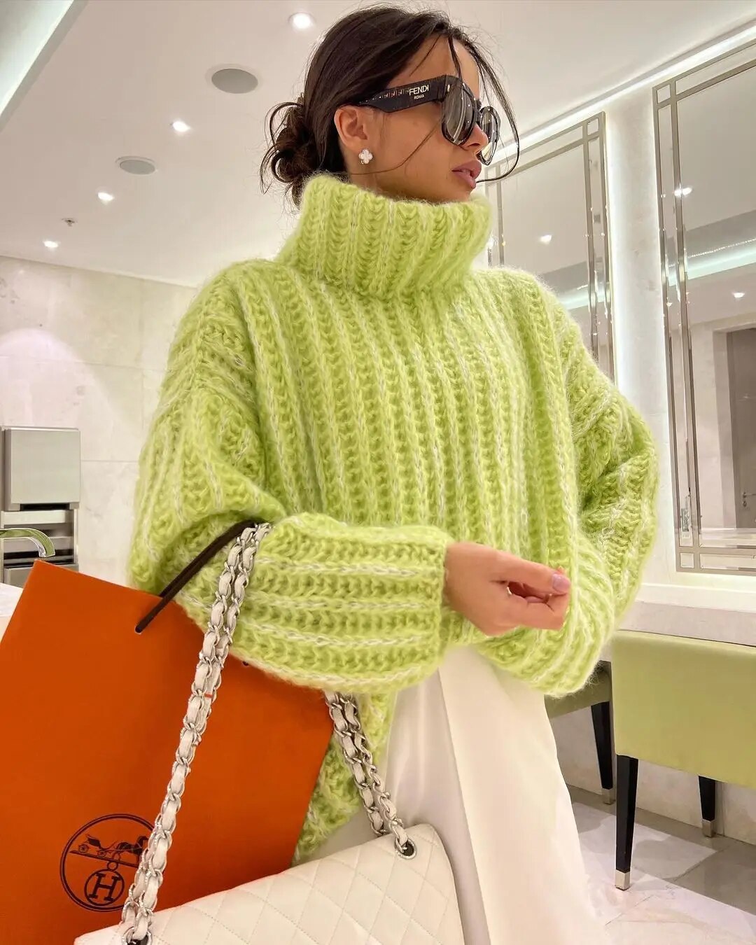 Women's oversized cream turtleneck sweater relaxed fit wide sleeves cozy layering essential