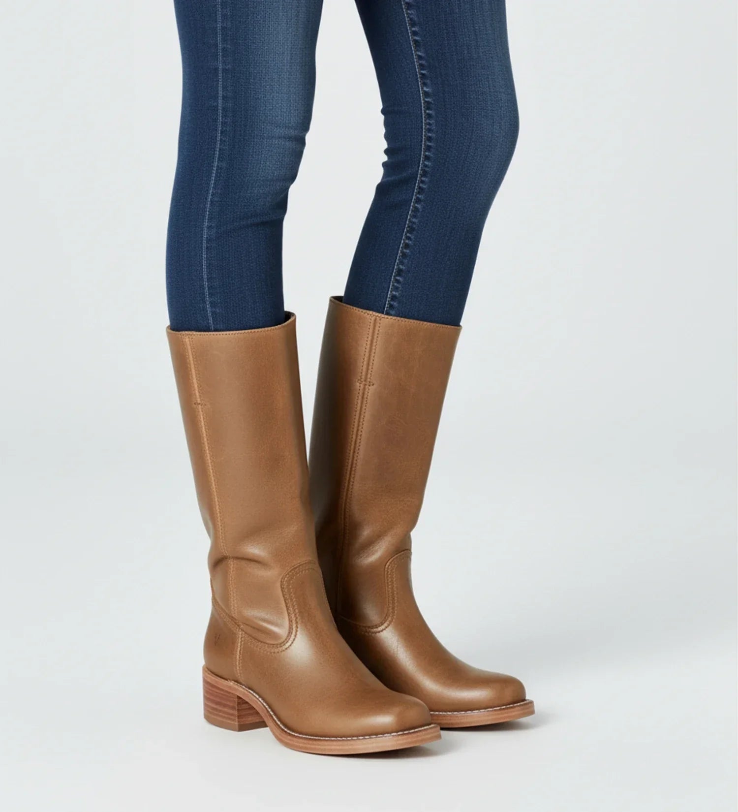 Women's black faux leather knee-high block heel boots with Western-inspired silhouette