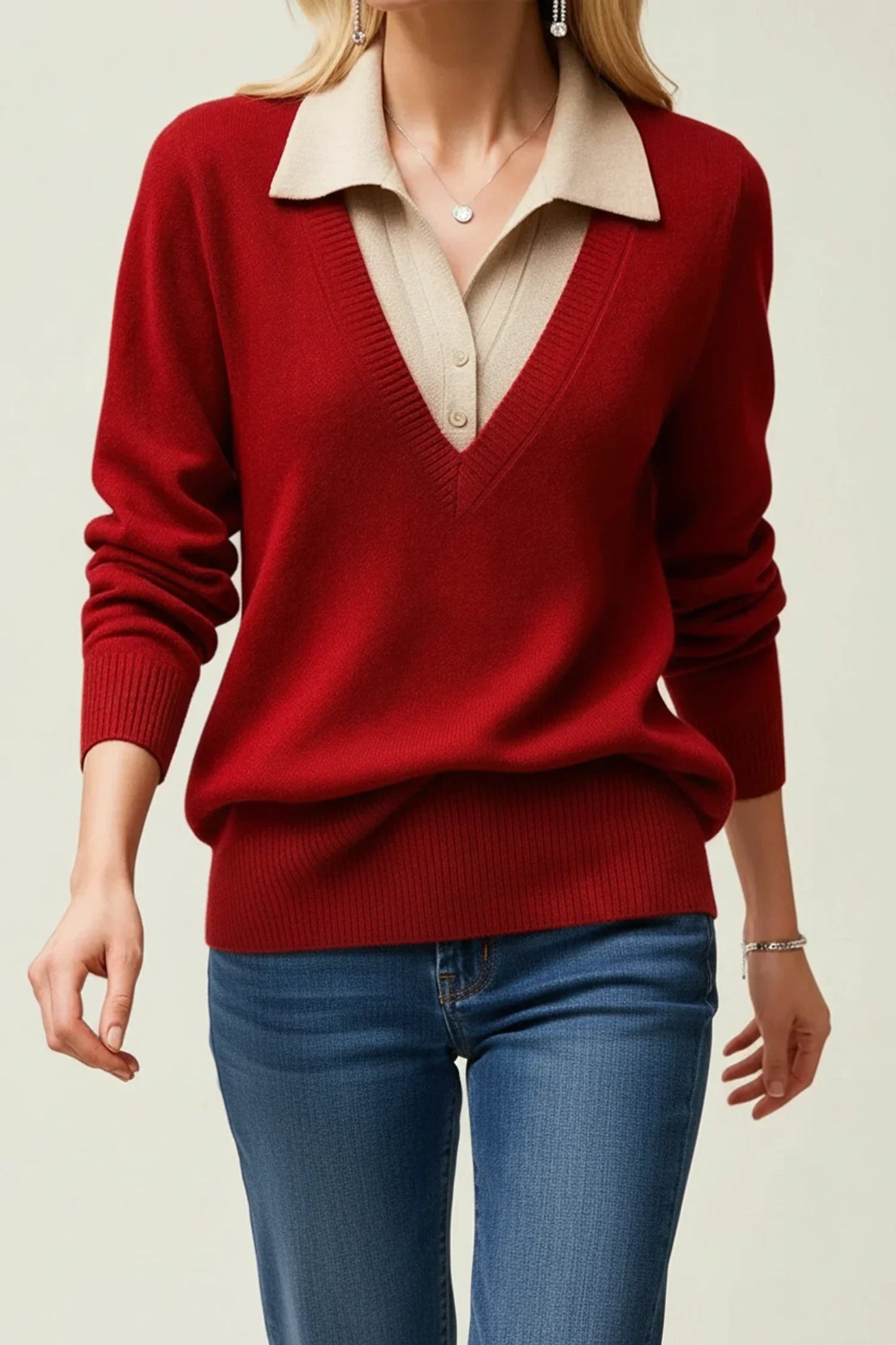 Women's ivory V-neck collared sweater with button cuff details, polished office-ready layered look