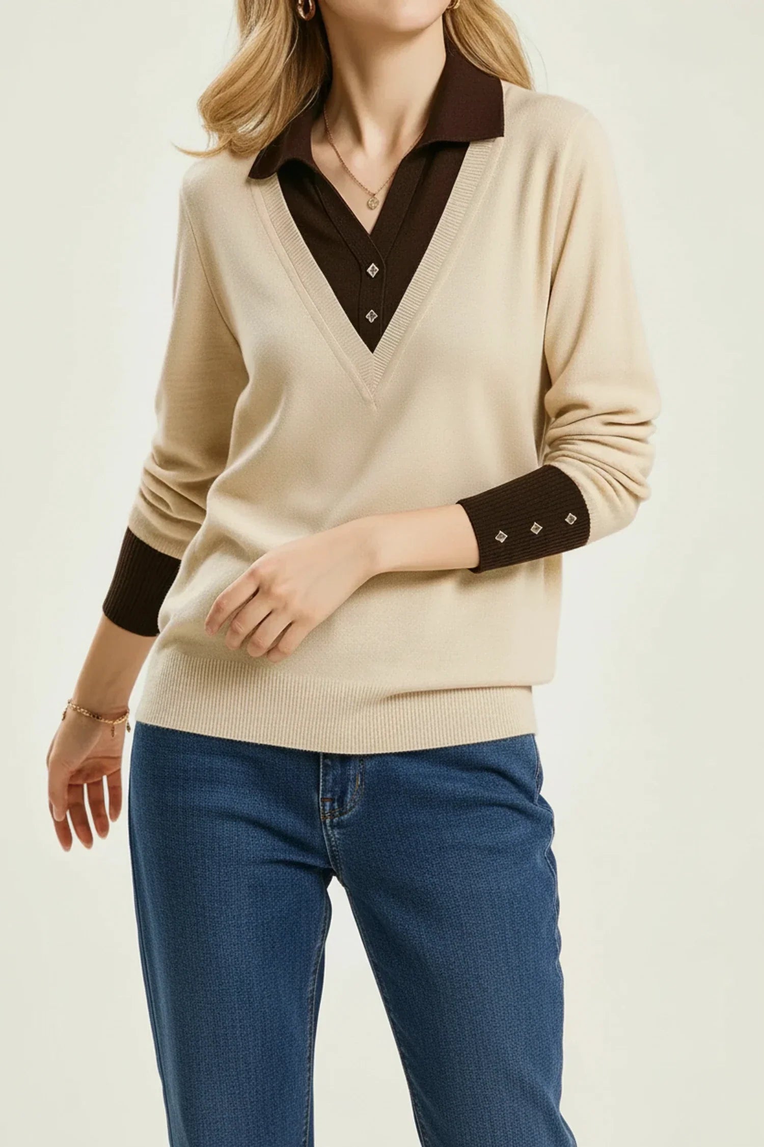 Women's beige v-neck collared sweater with button cuff details, polished office-ready knit layering piece