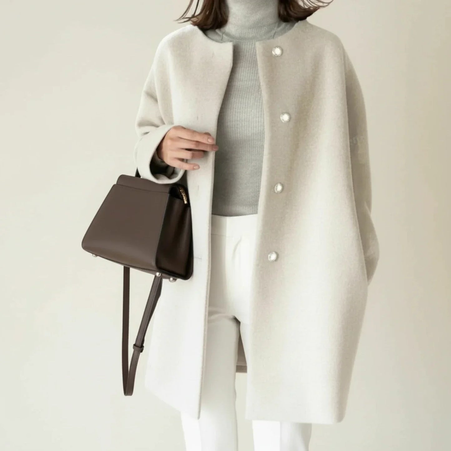 Women's minimalist collarless winter coat A-line mid-length button-front silhouette in neutral tone