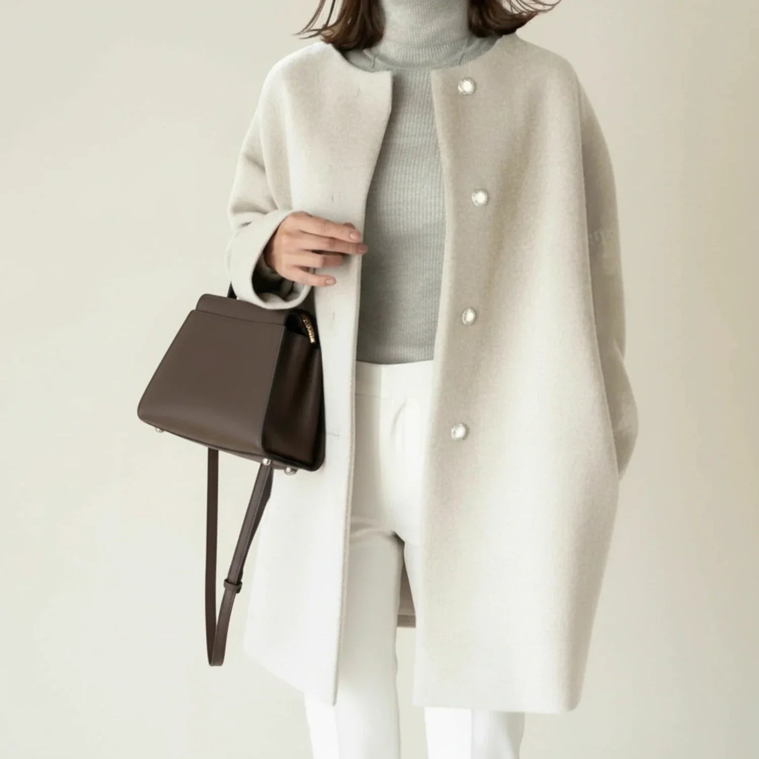 Women's minimalist collarless winter coat A-line mid-length button-front silhouette in neutral tone