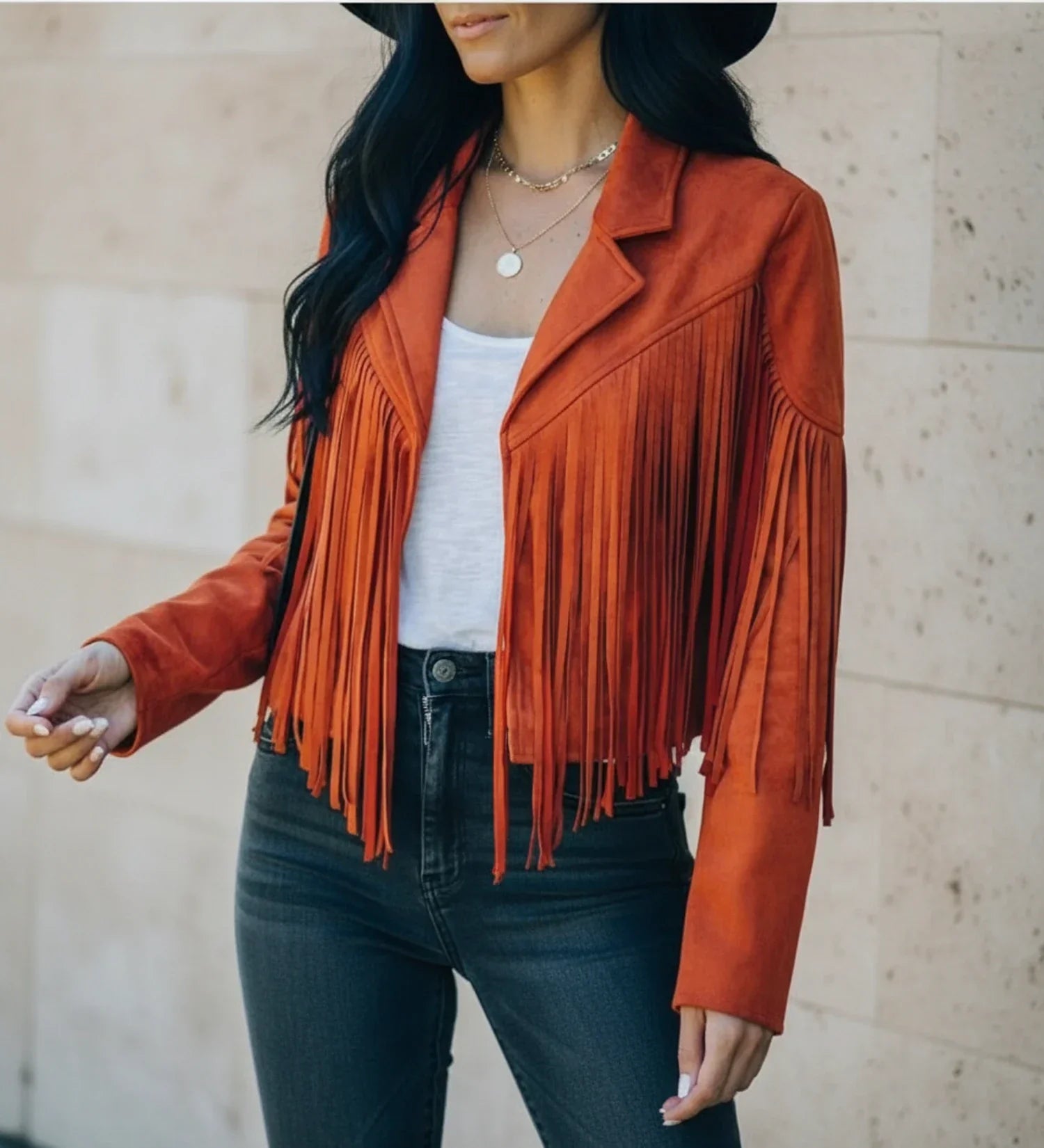 Women's cropped fringed moto jacket open front notch lapel bold Western style with flowing fringe detail