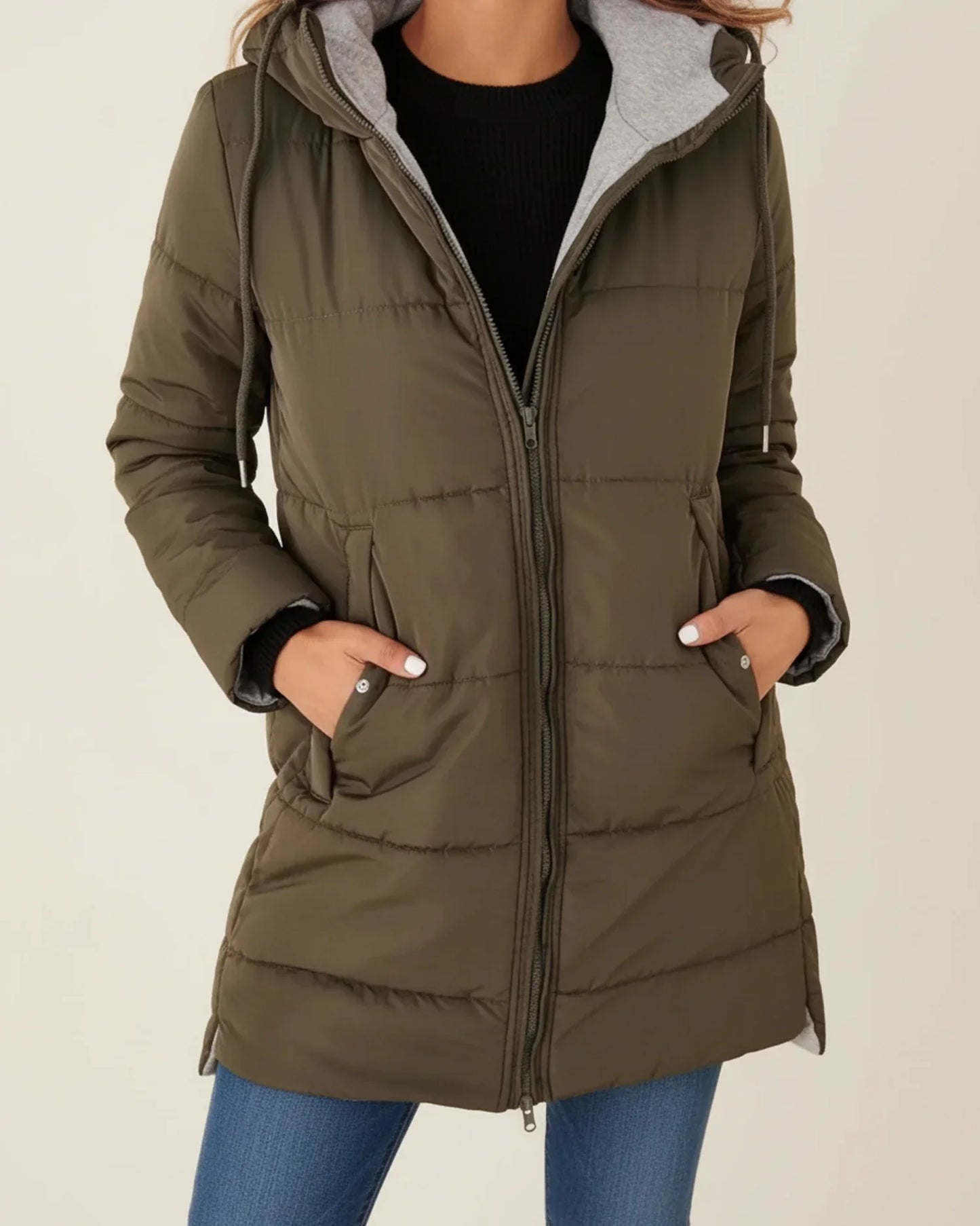 Women's long quilted hooded puffer jacket mid-length silhouette zip-up front cold weather city style