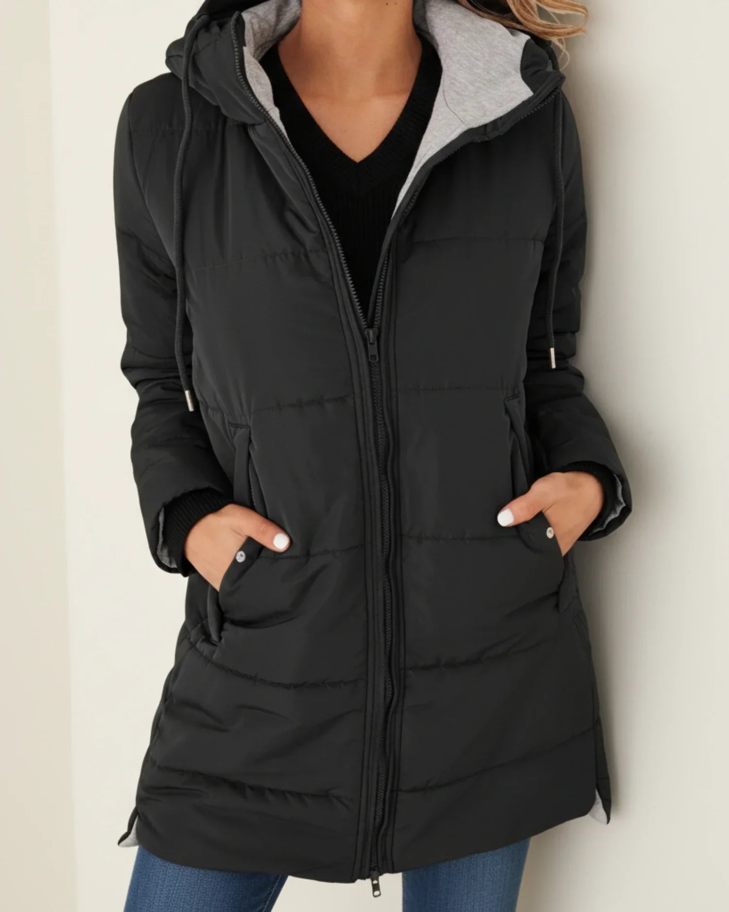 Women's long quilted hooded puffer jacket, mid-length silhouette with front zip closure for winter warmth