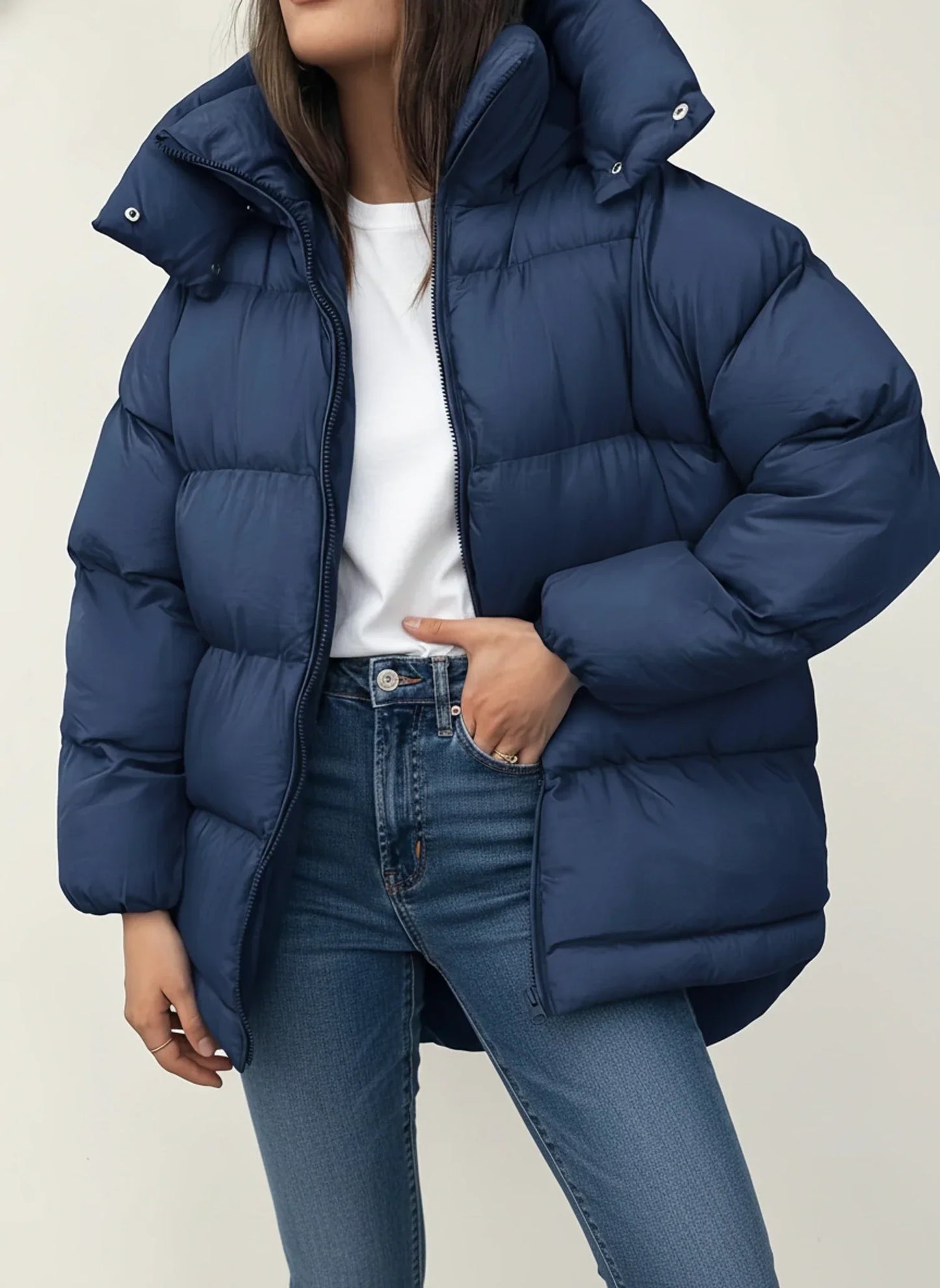 Women's oversized hooded puffer jacket in winter style with hip-length silhouette for ultimate warmth