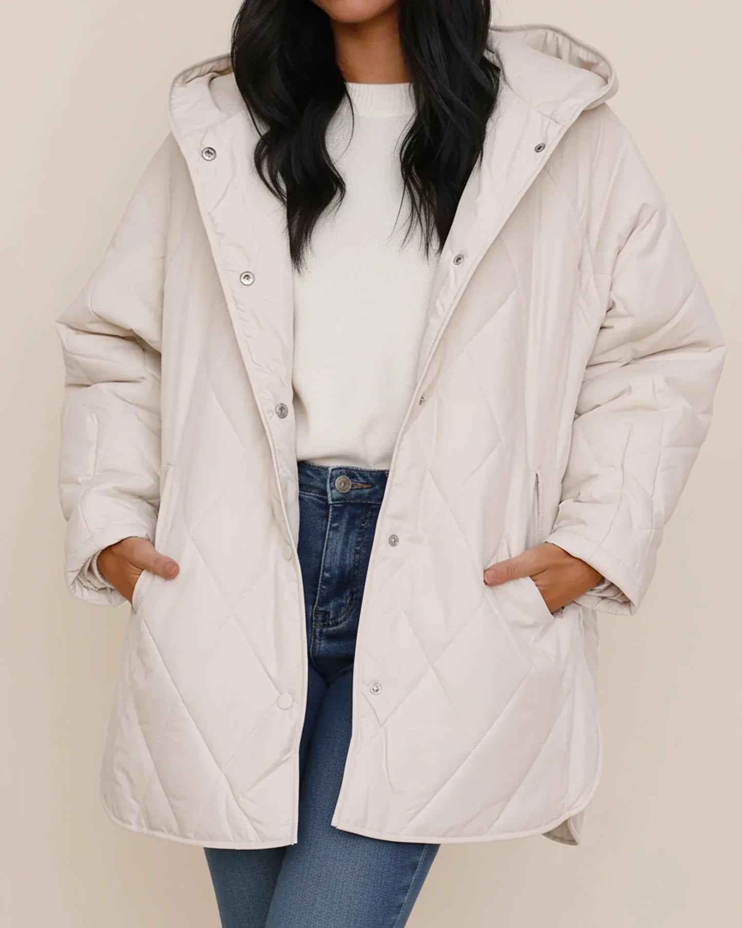 Women's oversized quilted longline hooded winter jacket in neutral tone for everyday warmth