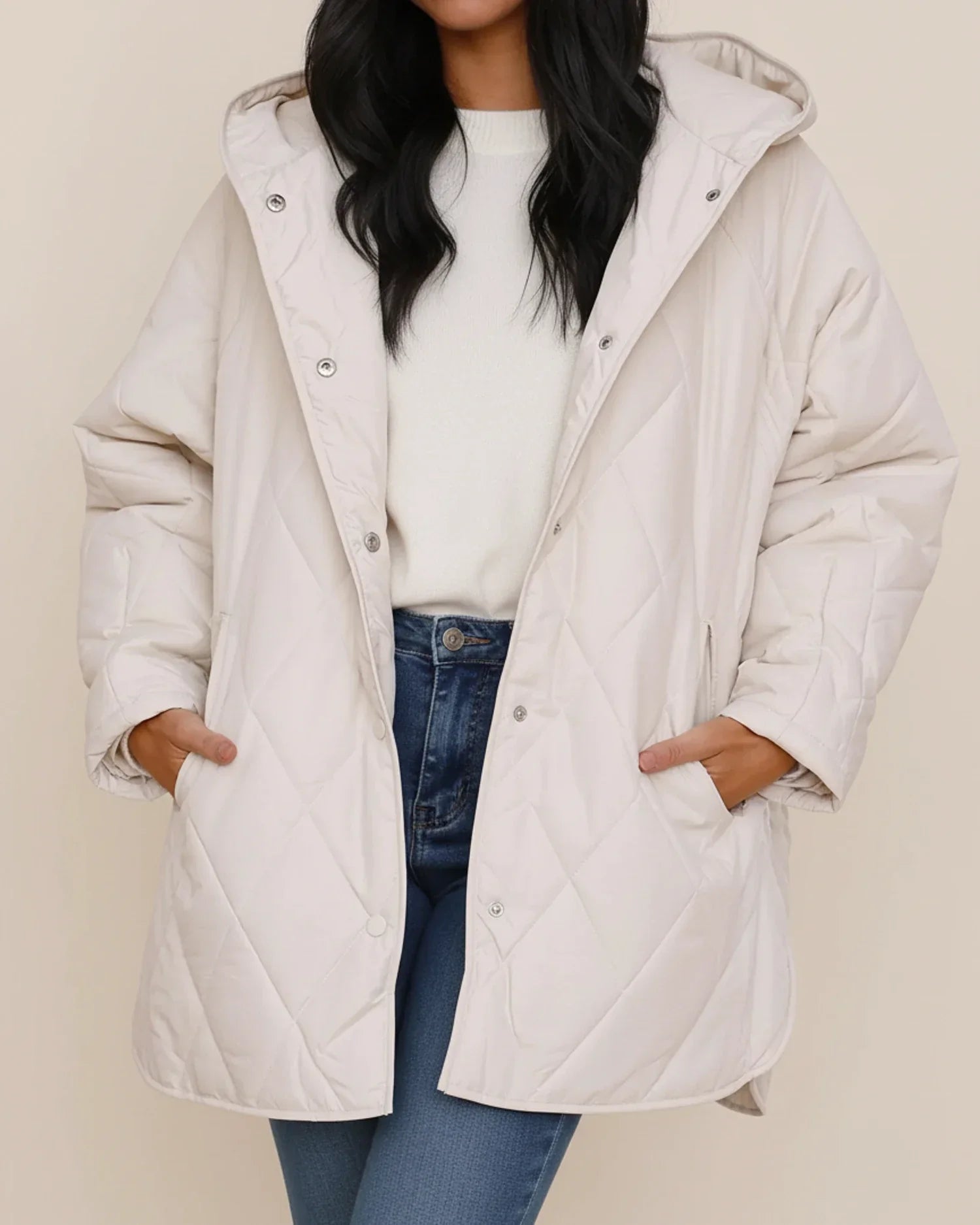Women's oversized quilted longline hooded winter jacket in neutral tone for everyday warmth