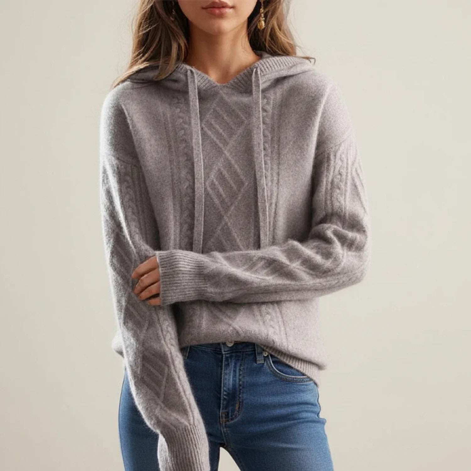 Women's beige cable knit hooded pullover sweater with drawstring hood, relaxed cozy fit