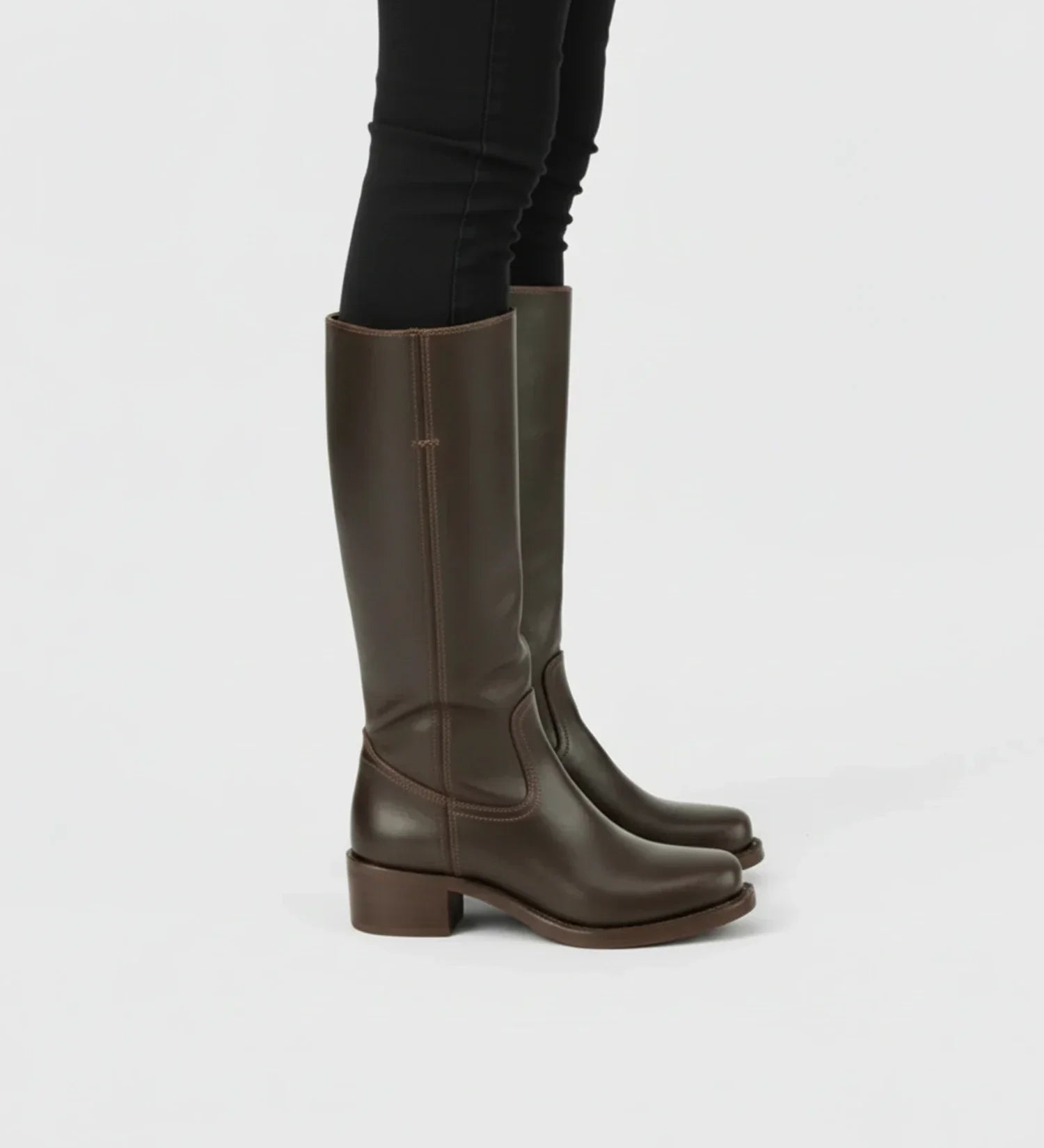 Women black faux leather knee-high boots block heel western style with elongated silhouette