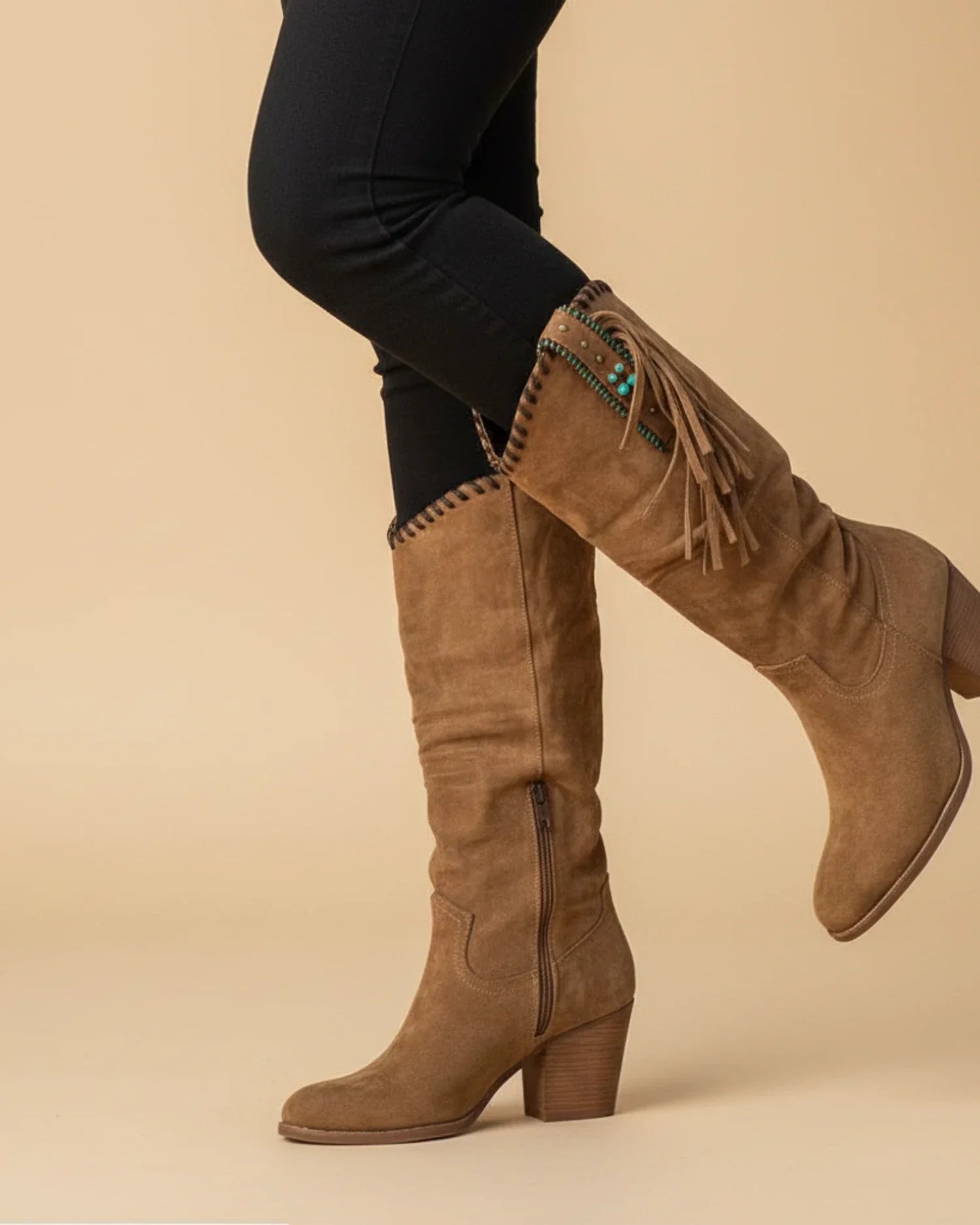 Women's knee-high western boots with fringe detailing, sleek elongated shaft for modern style