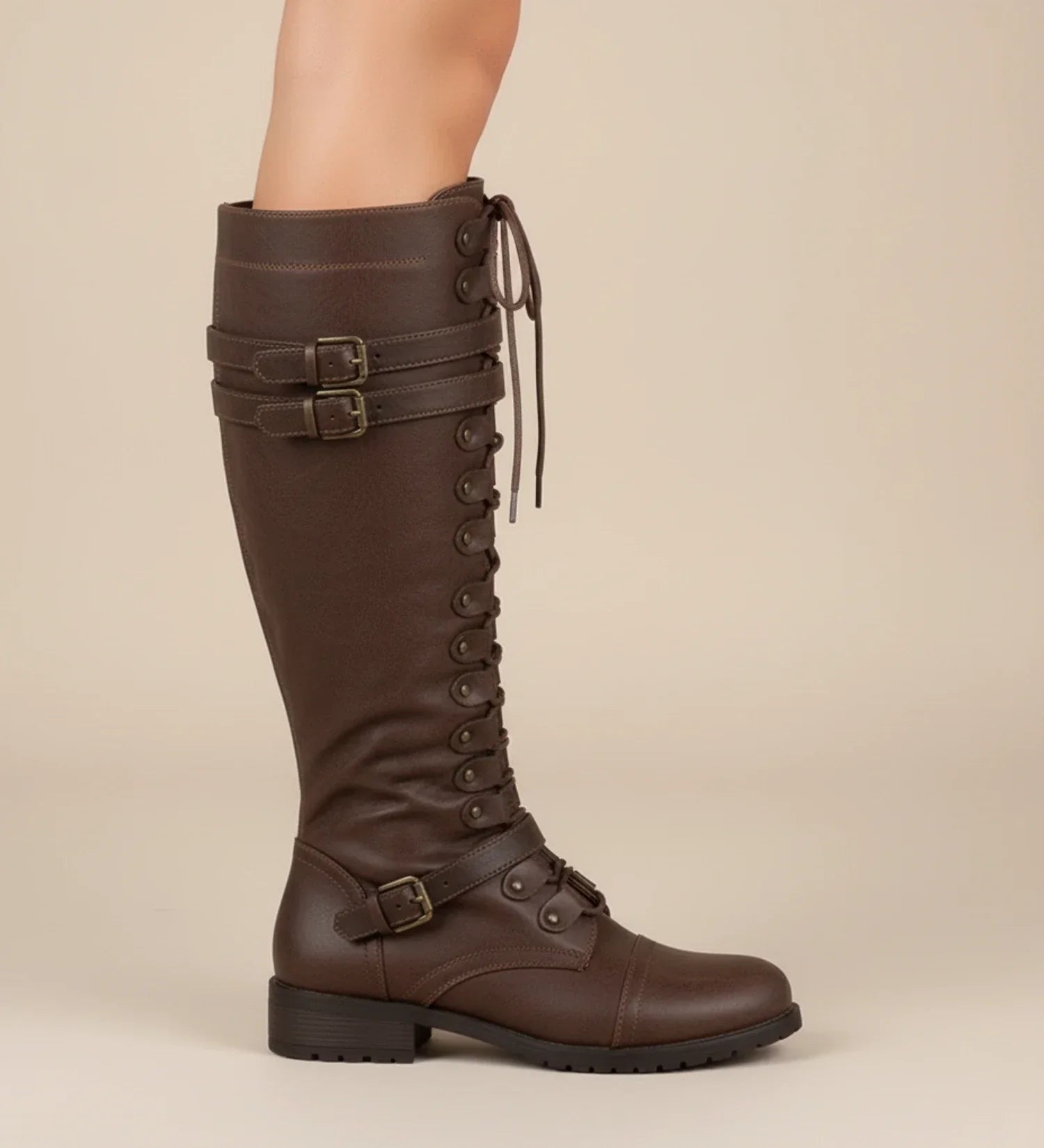 Women's black knee-high lace-up combat boots with buckle detail for edgy everyday style