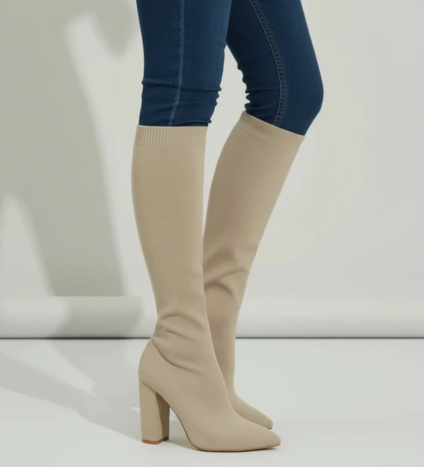 Women's black knit knee-high block heel sock boots with pointed toe pull-on style