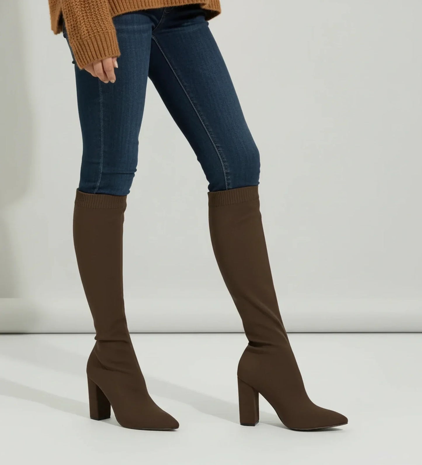 Women's black knit knee-high block heel sock boots with sleek pointed toe pull-on style