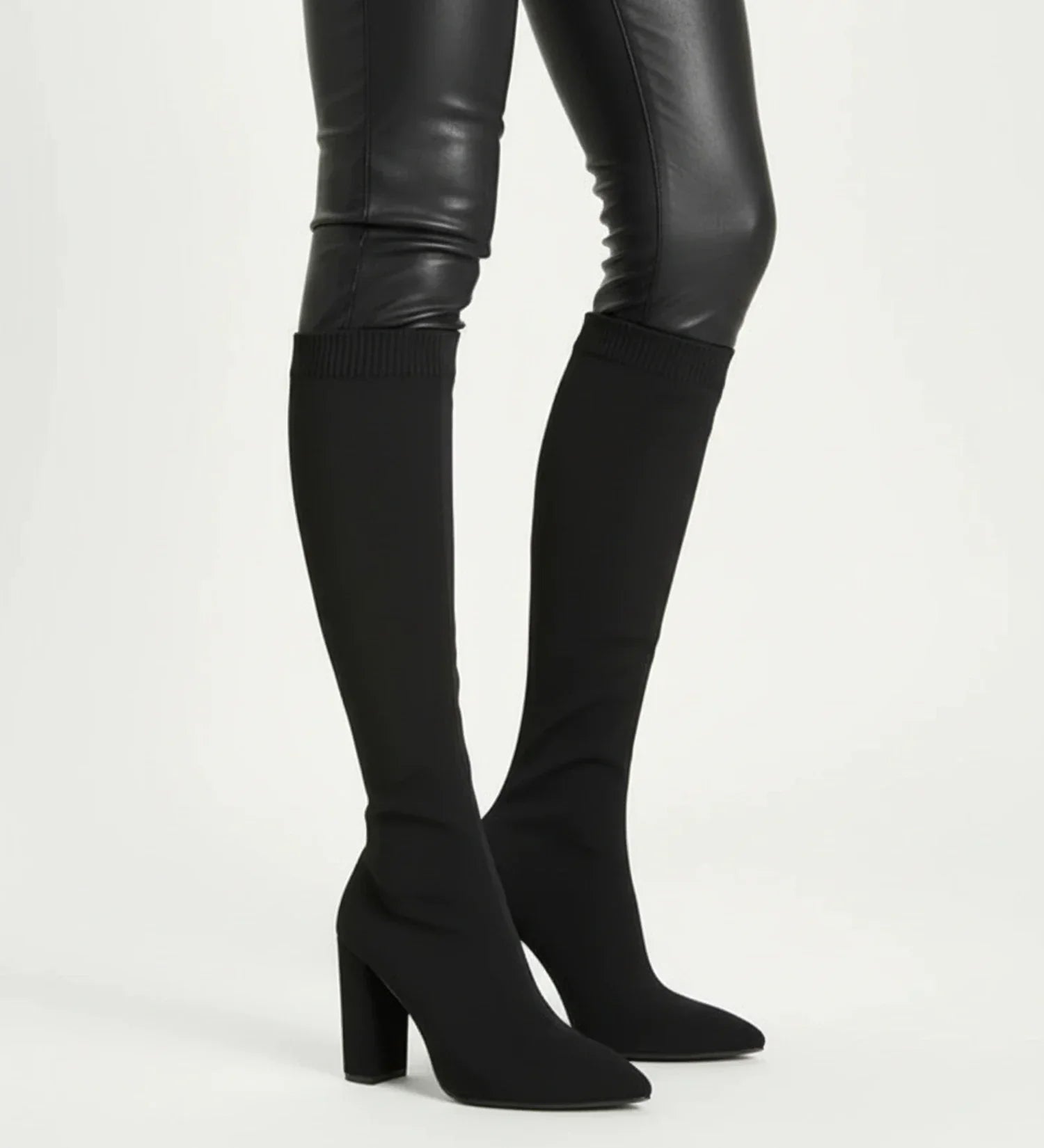 Women's black knit knee-high block heel boots with pointed toe pull-on sock style