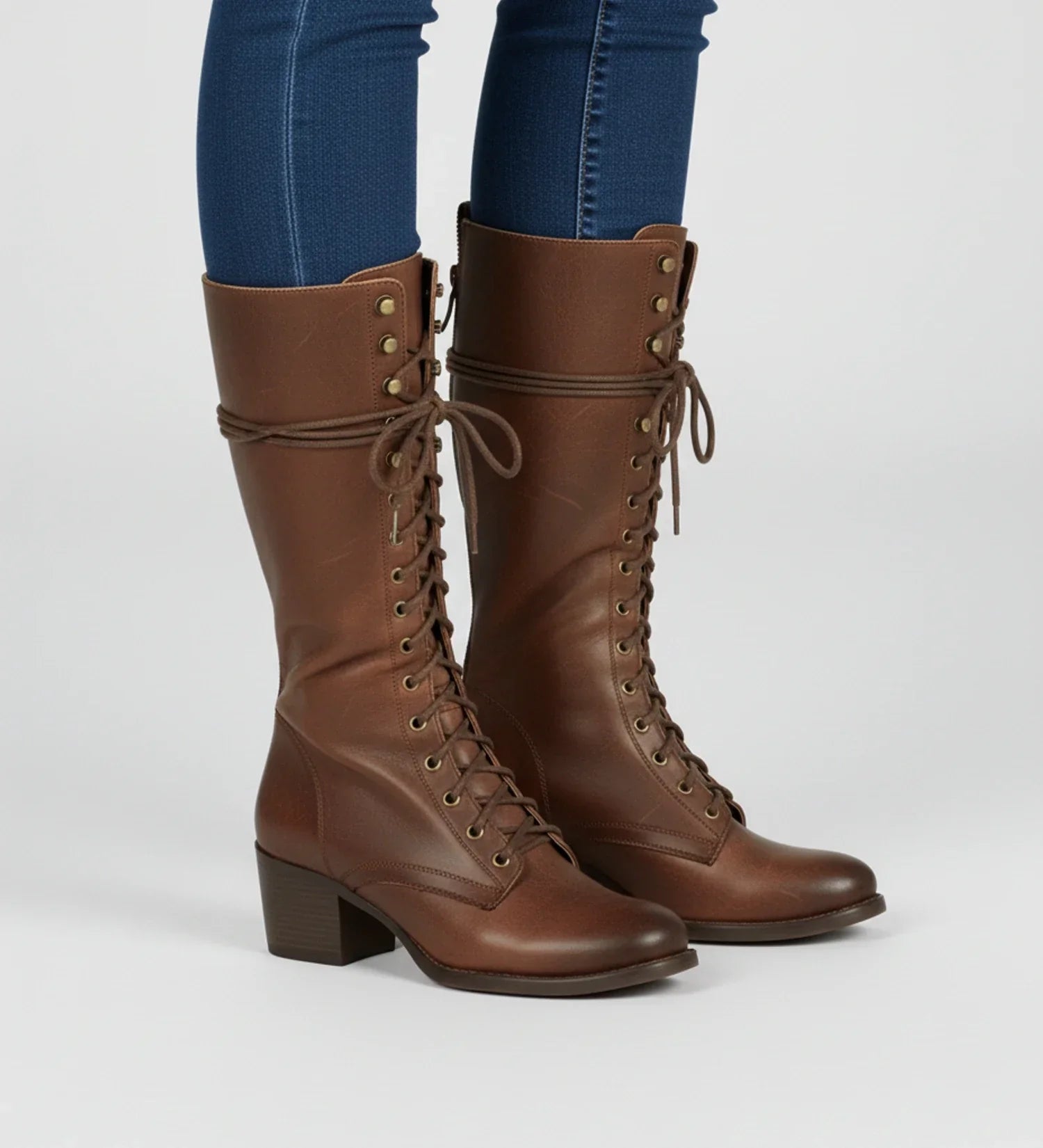 Women's black knee-high combat boots block heel lace-up grommet detailing back zipper edgy style