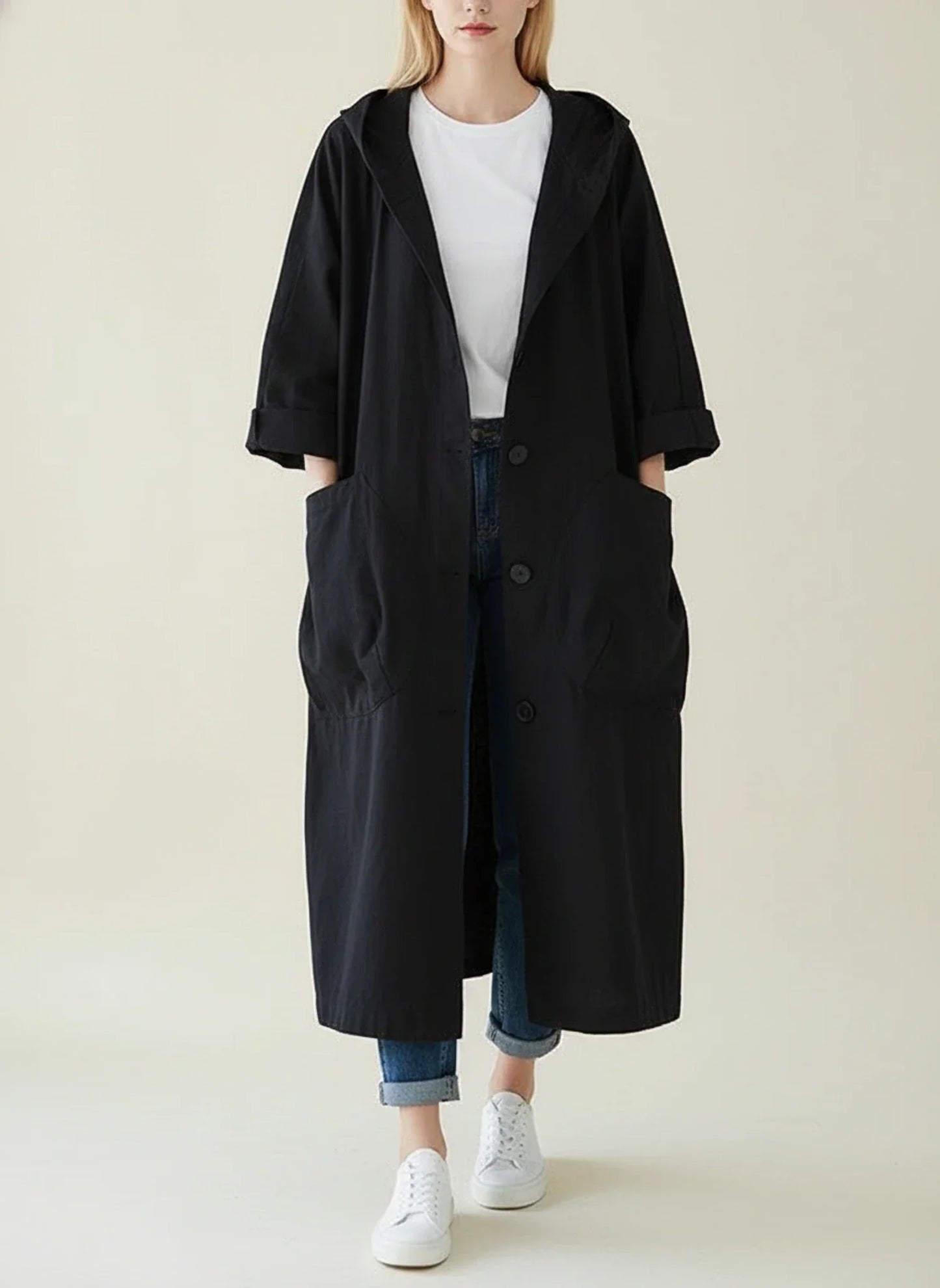 Women's waterproof hooded trench coat in sleek oversized silhouette with long length coverage