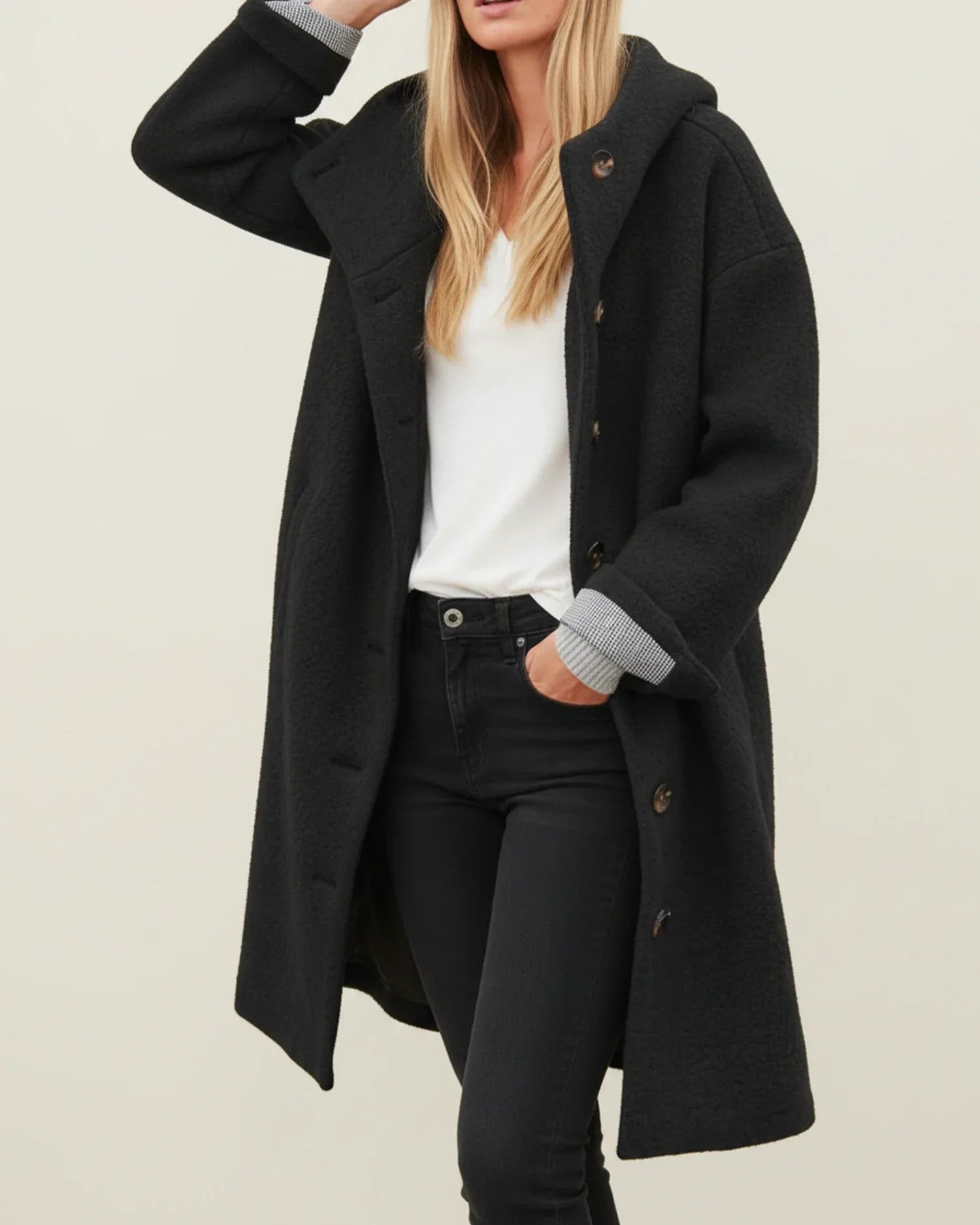 Women's oversized hooded long winter coat in neutral tone with button front closure