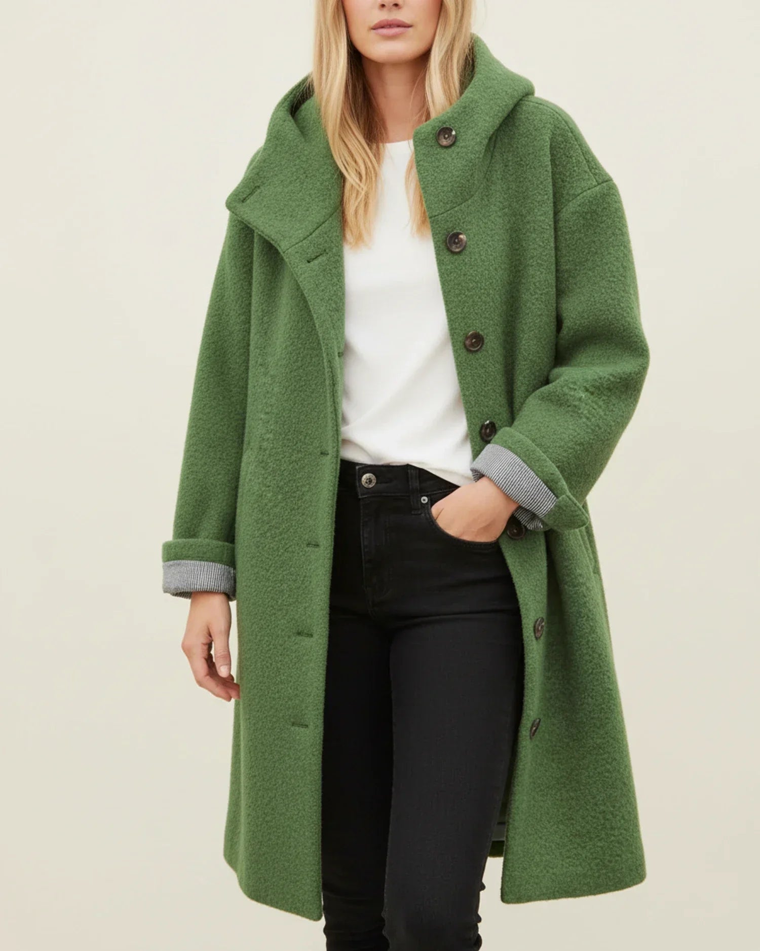Women's oversized hooded long winter coat with button front closure in classic cold-weather style