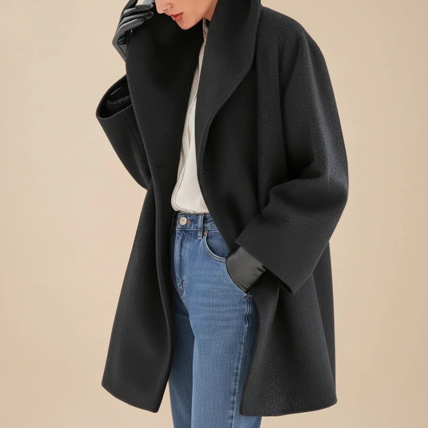 Women's oversized mid-length winter coat swing silhouette wide collar effortless chic style