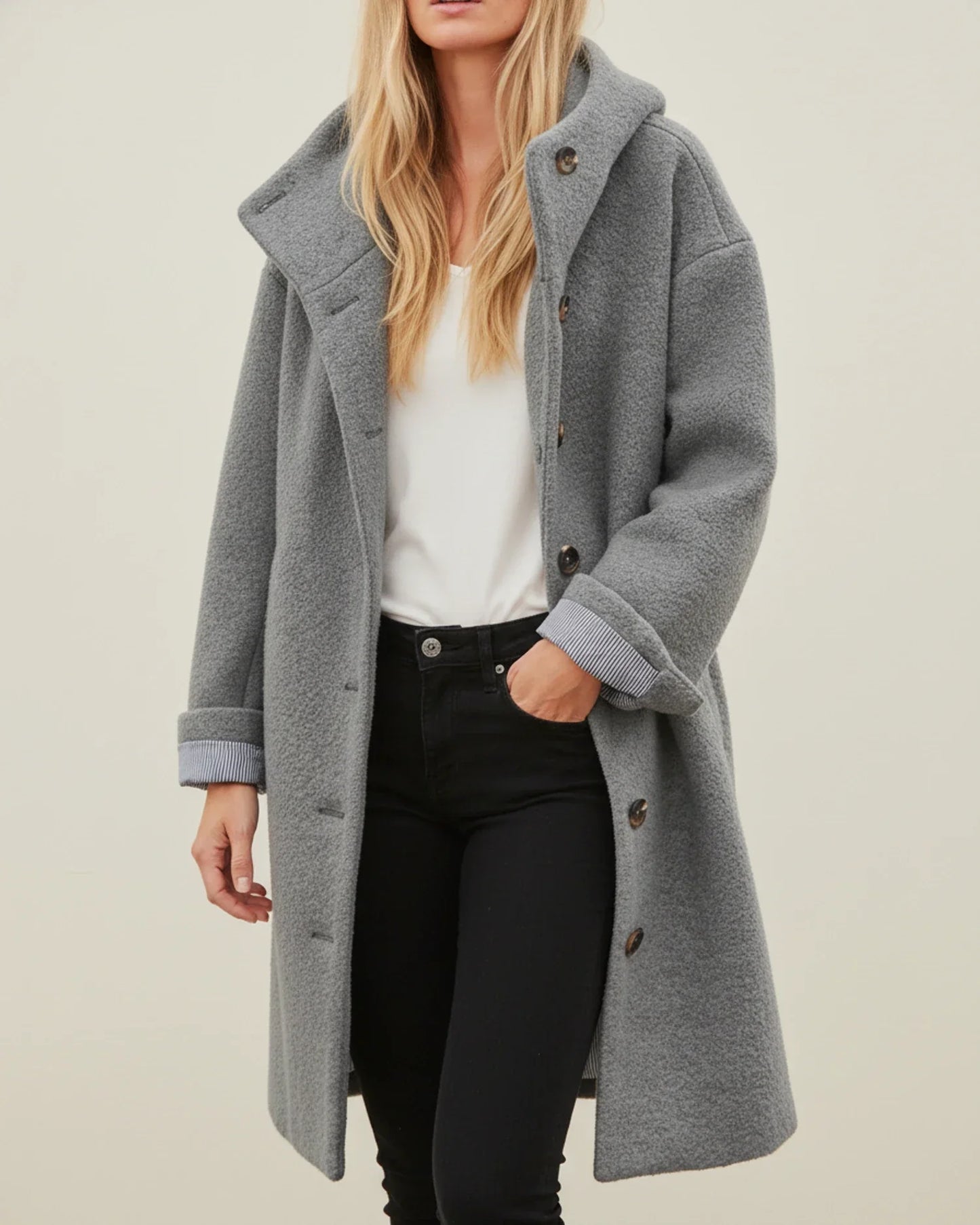 Women's oversized hooded long winter coat with button front closure in classic everyday style
