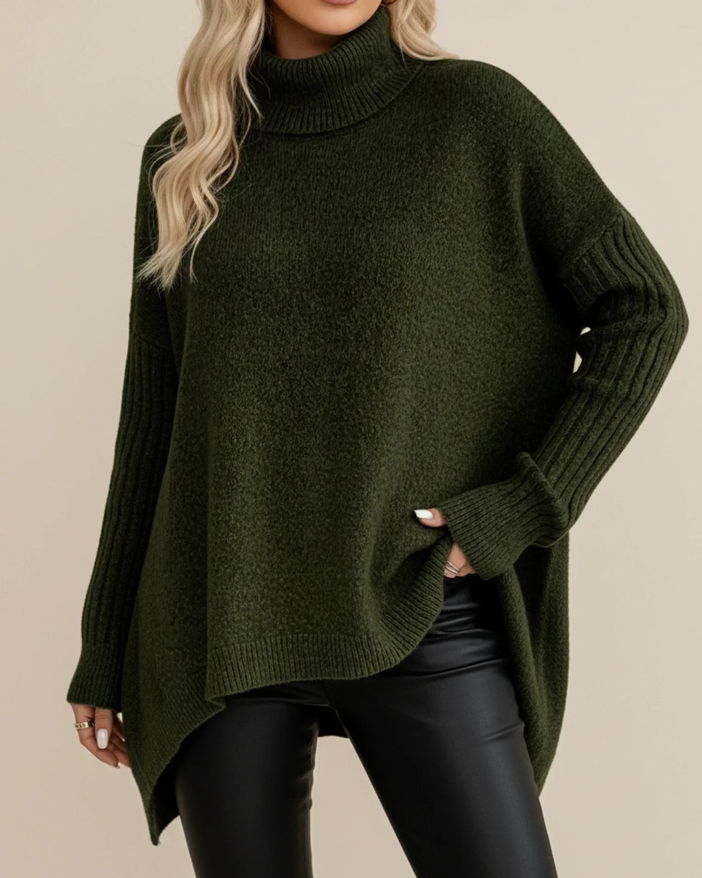 Women's oversized ribbed knit turtleneck sweater with asymmetric hem, cozy layering style