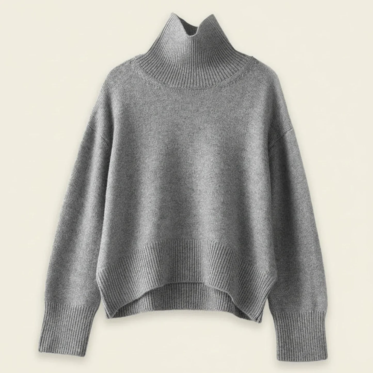 Women's oversized turtleneck knit sweater in cozy ribbed texture, relaxed fit for casual cold-weather layering