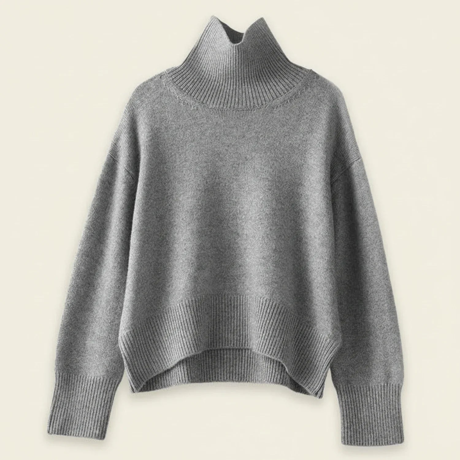 Women's oversized turtleneck knit sweater in cozy ribbed texture, relaxed fit for casual cold-weather layering