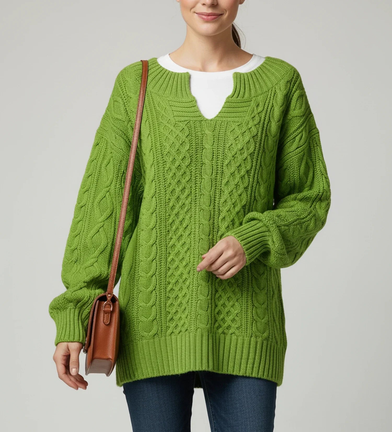 Women's oversized cable knit V-neck sweater in cozy relaxed fit with intricate textured pattern