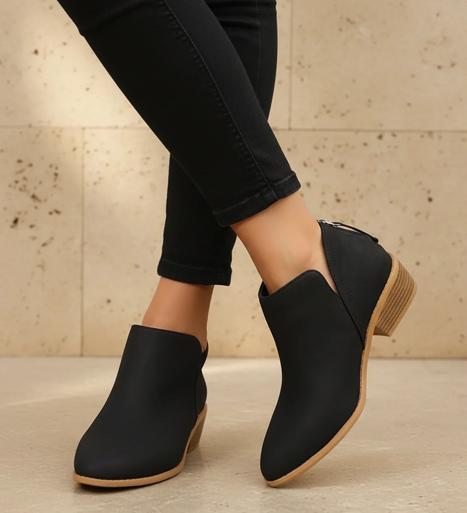 Women's black pointed toe ankle boots with low block heel and V-cutout detail