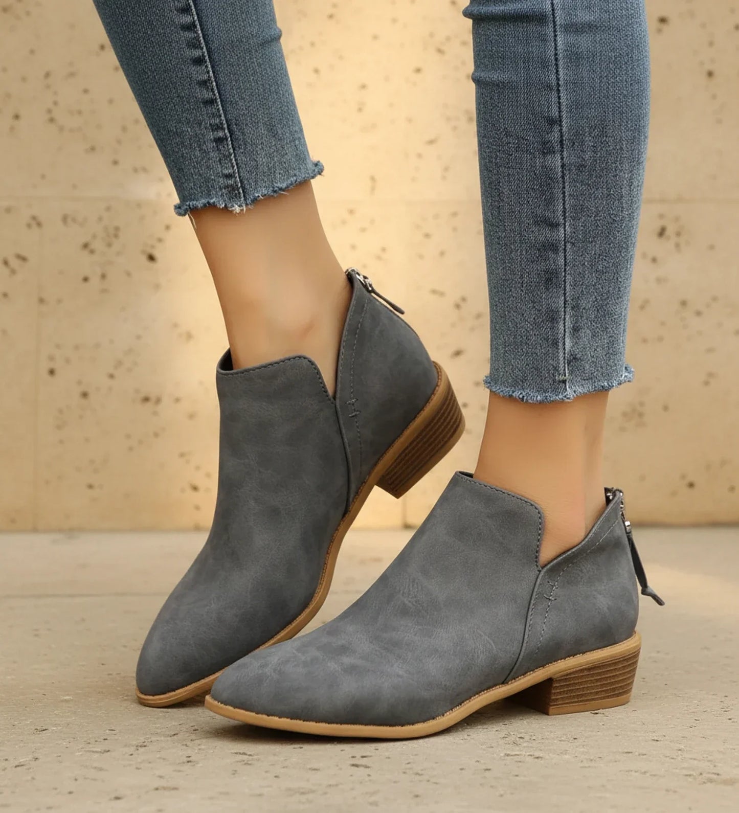 Women's black pointed toe ankle boots with V-cutout and low block heel for versatile everyday style