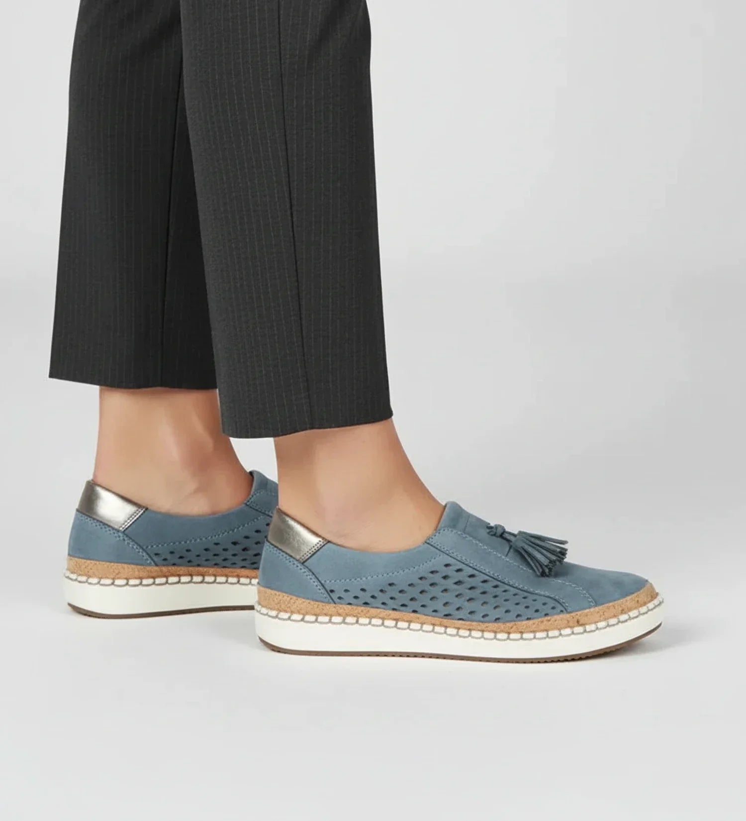 Women's slip-on perforated tassel loafer sneaker in neutral tone with breathable upper for on-the-go style