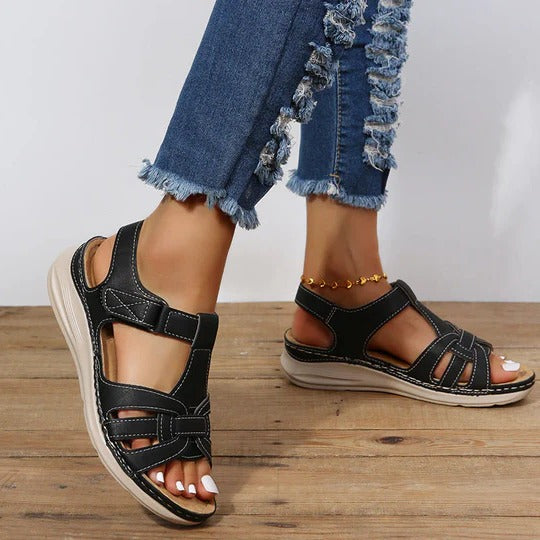 Women's beige adjustable sandals with contoured footbed and three hook-and-loop straps for all-day comfort