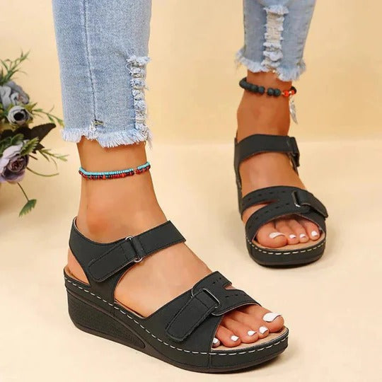 Women's flat walking sandals with adjustable twin buckle straps and open heel slip-on design
