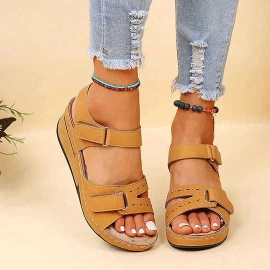 Women's flat walking sandals with adjustable twin buckle straps and open heel slip-on design