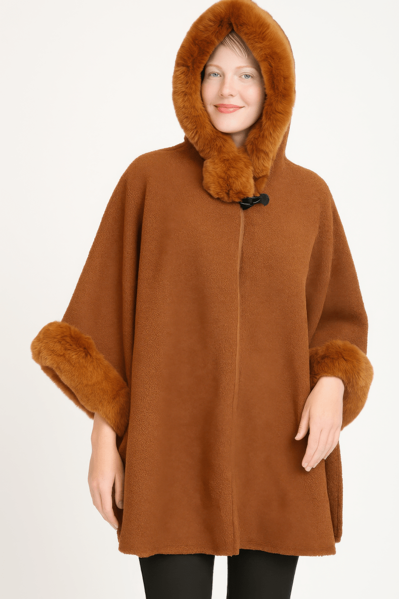 Women's black hooded cape with plush faux fur trim, wide sleeves, luxurious formal winter wear